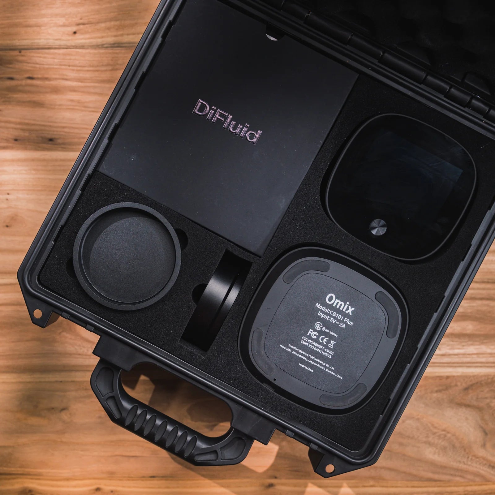 The DiFluid Omix Plus packed in its carrying case
